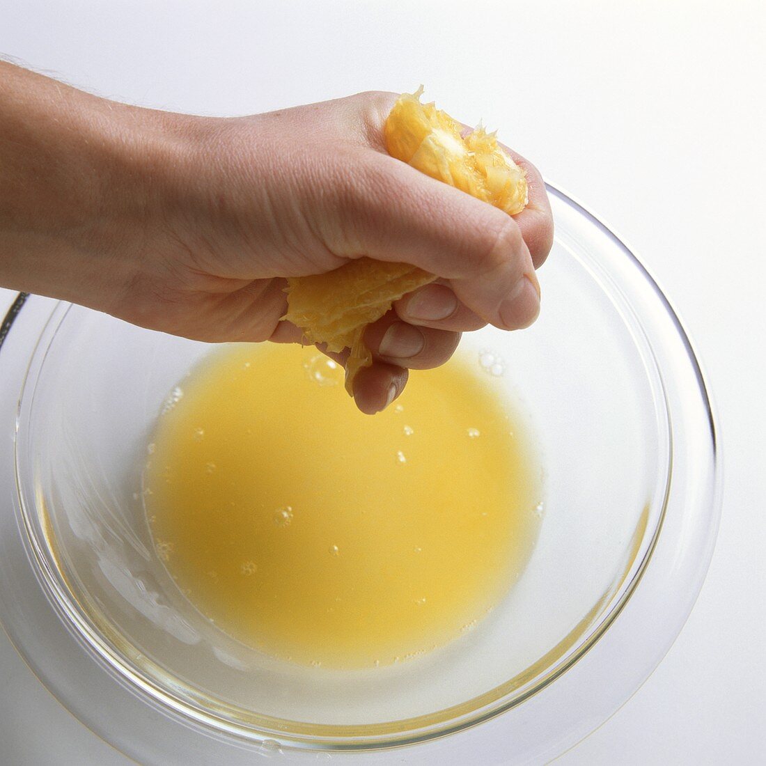 Squeezing a peeled orange