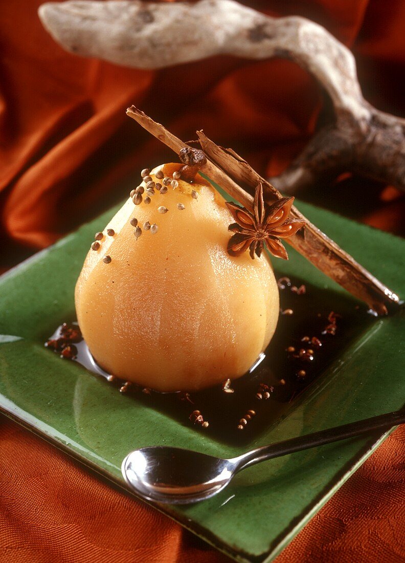Poached pear with spiced sauce