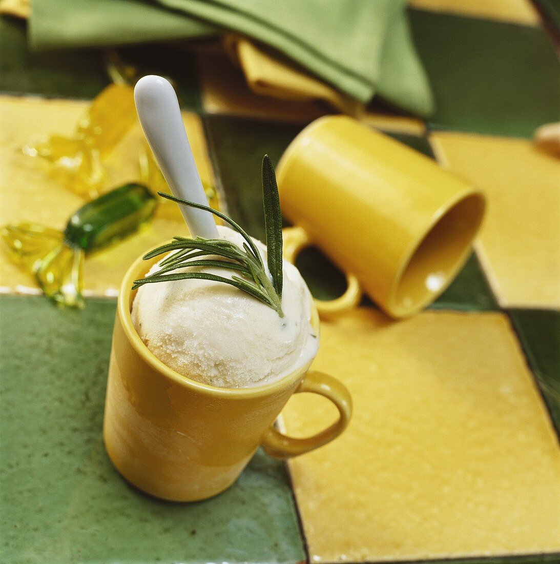 Vanilla ice cream with rosemary in yellow beaker