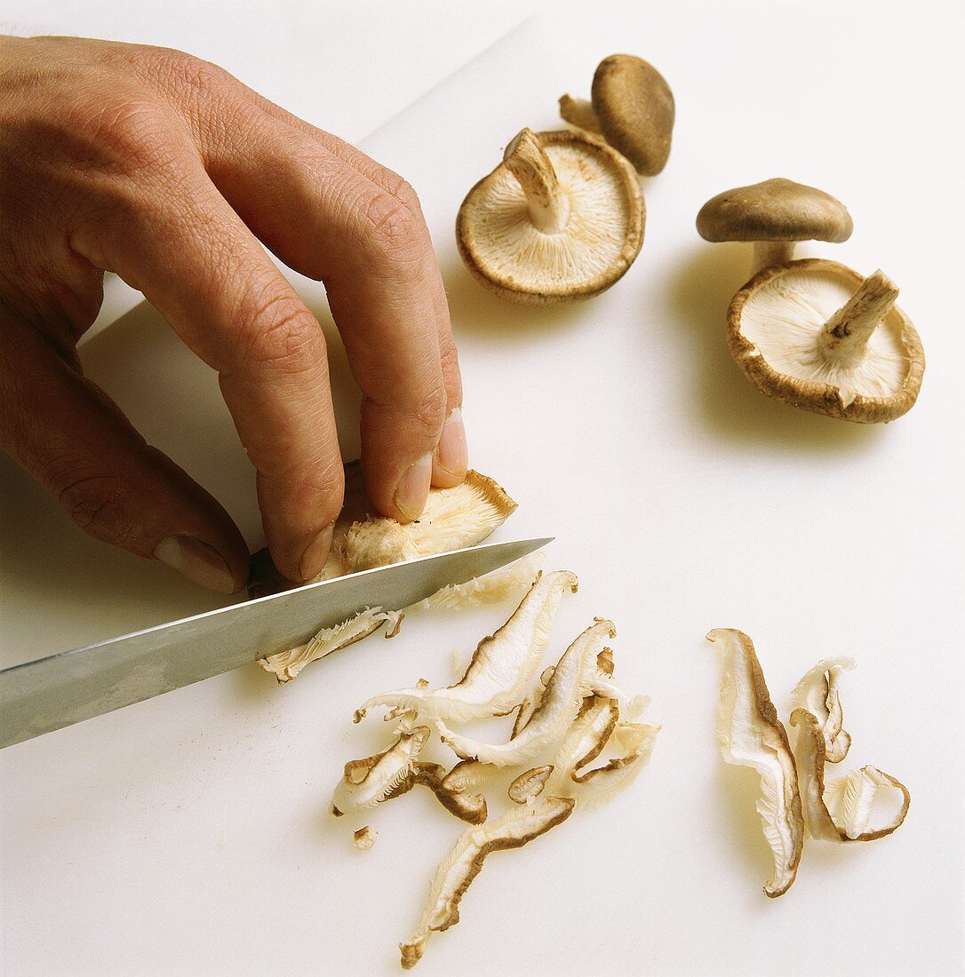 Cutting mushrooms into strips