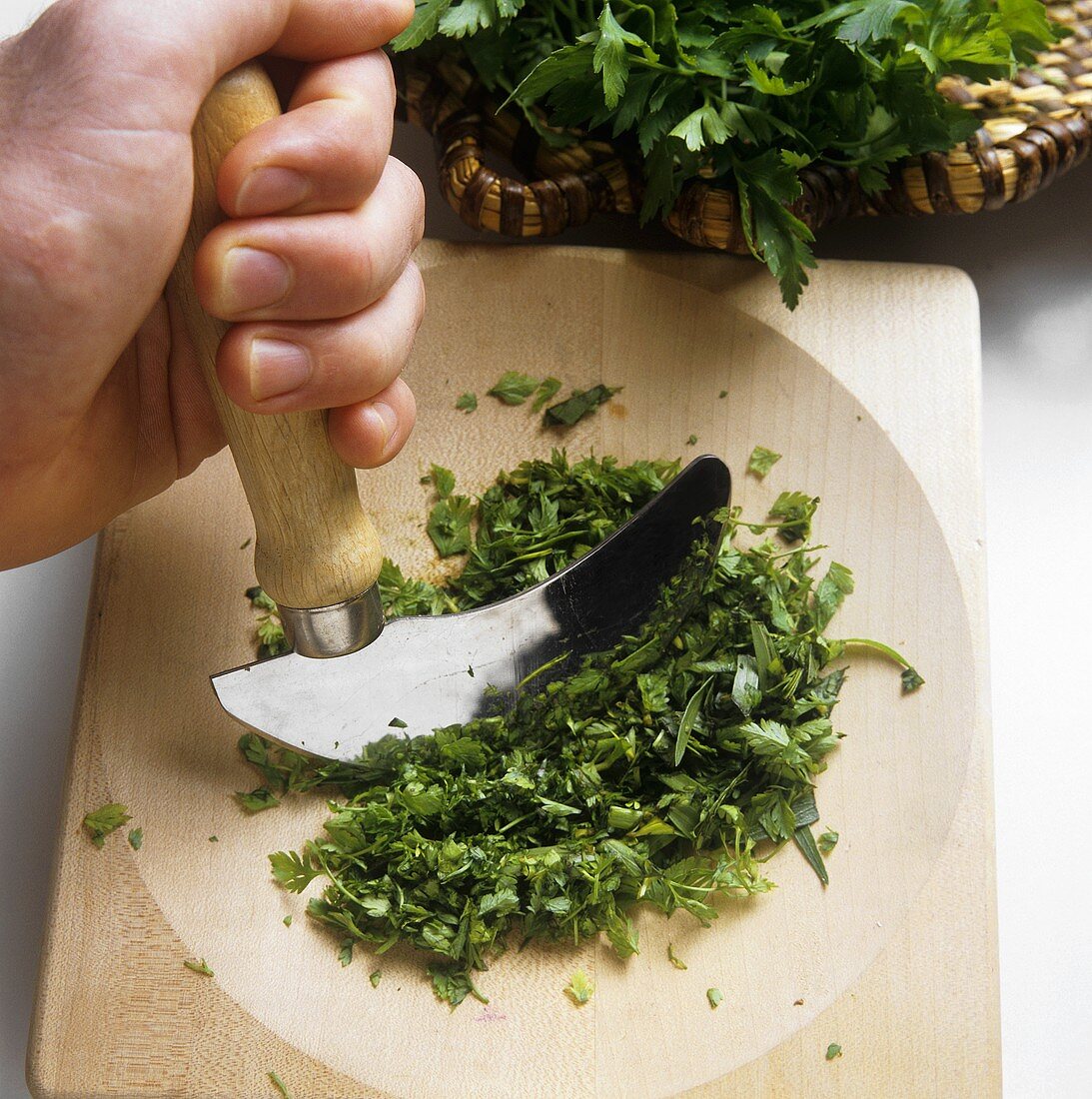 Chopping parsley with a mezzaluna