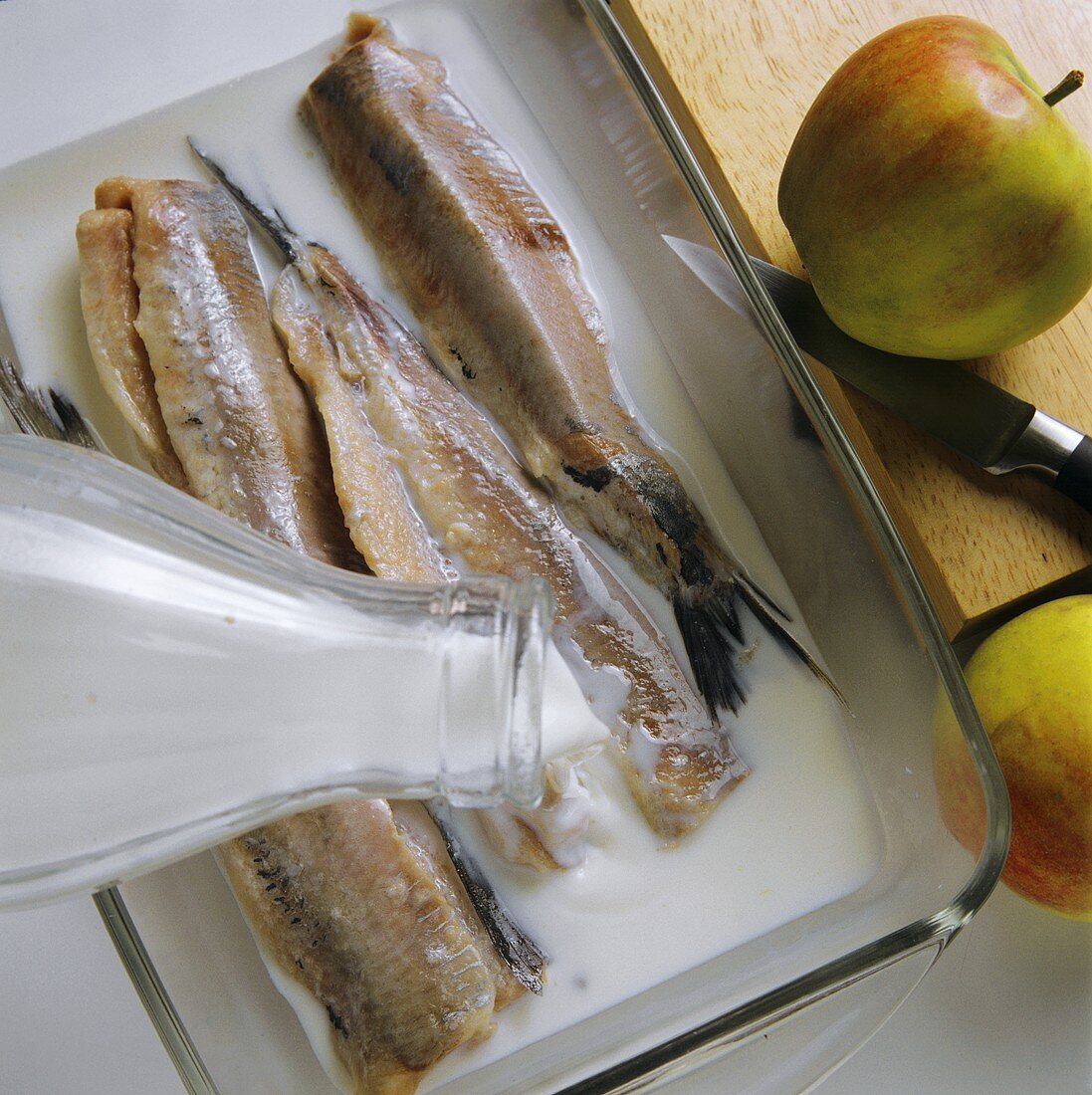 Pickling young herrings (matjes)
