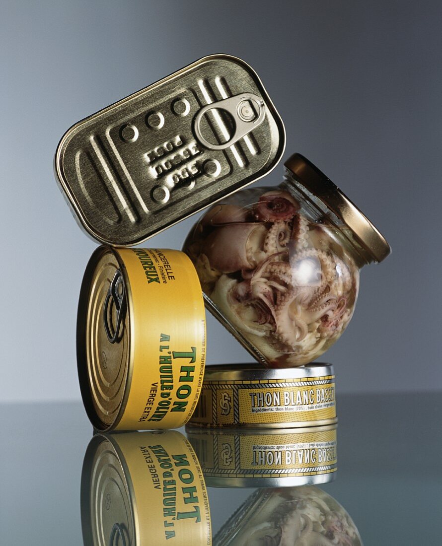 Tuna fish tins, sardine tins and a jar of seafood