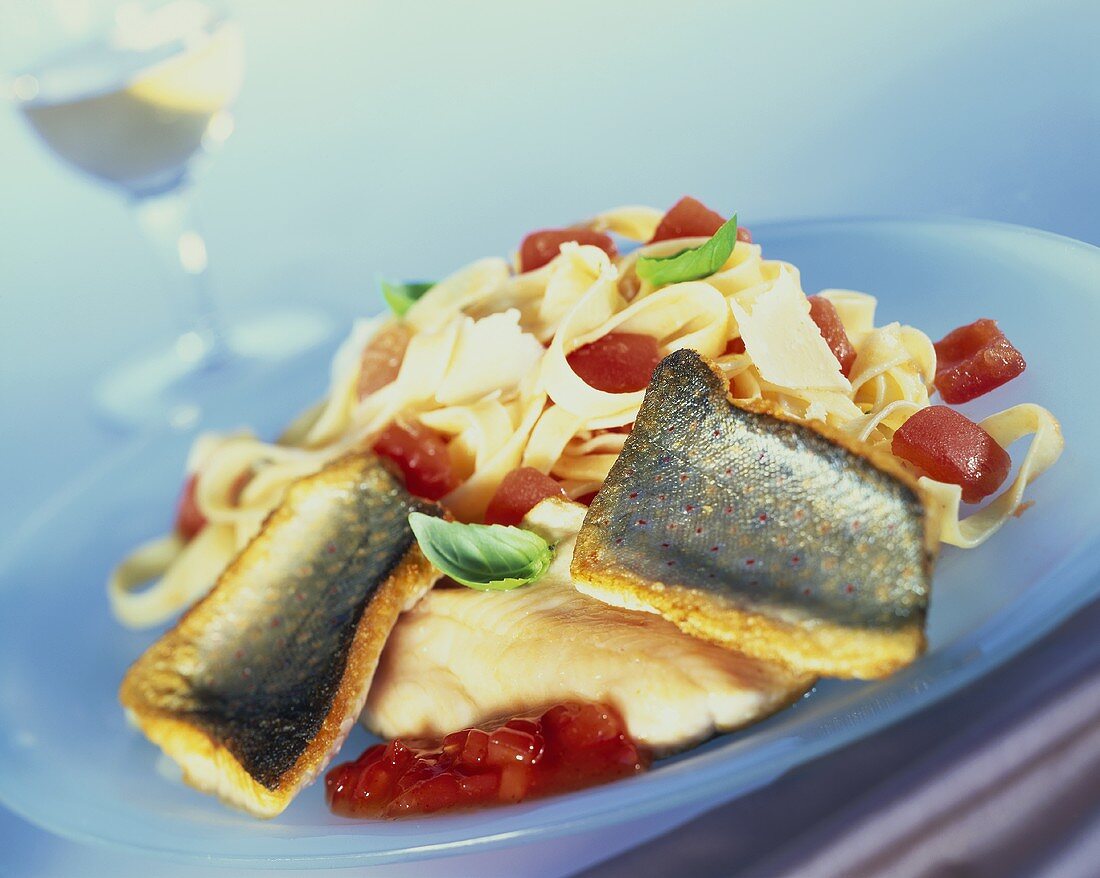 Fried brook trout with pasta with tomatoes and basil