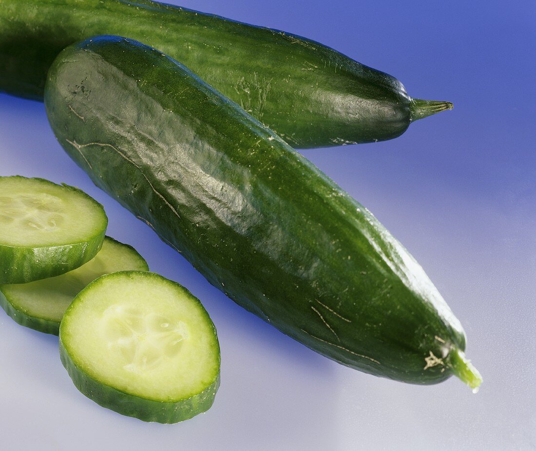 Whole cucumbers and cucumber slices