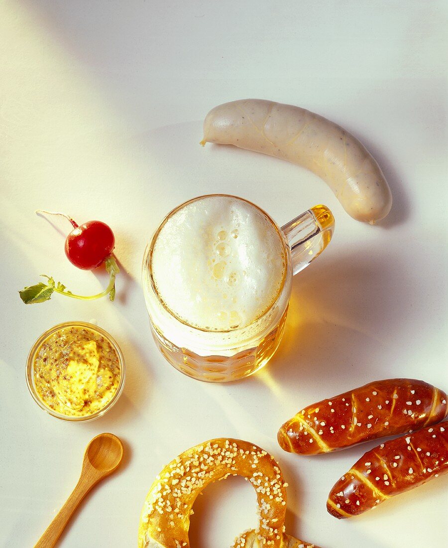 Snack of Weisswurst, pretzel, mustard, radishes and beer