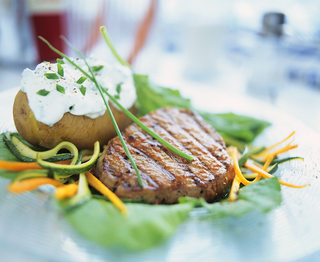 Beef steak and baked potato with herb quark