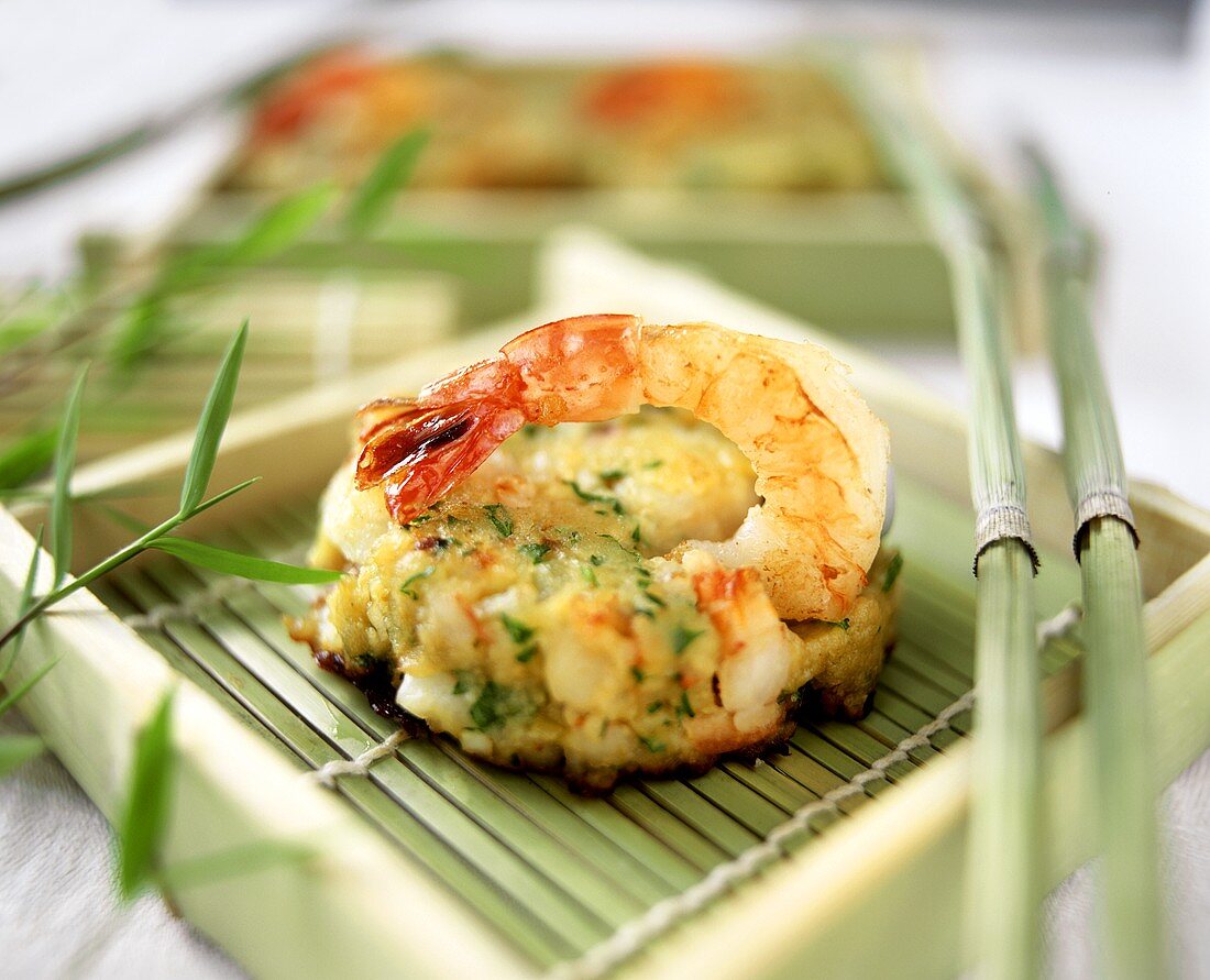 Fish and shrimp cakes on bamboo mat