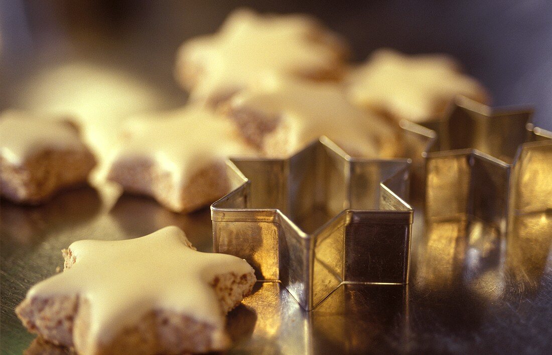 Cinnamon stars with white icing; cutters