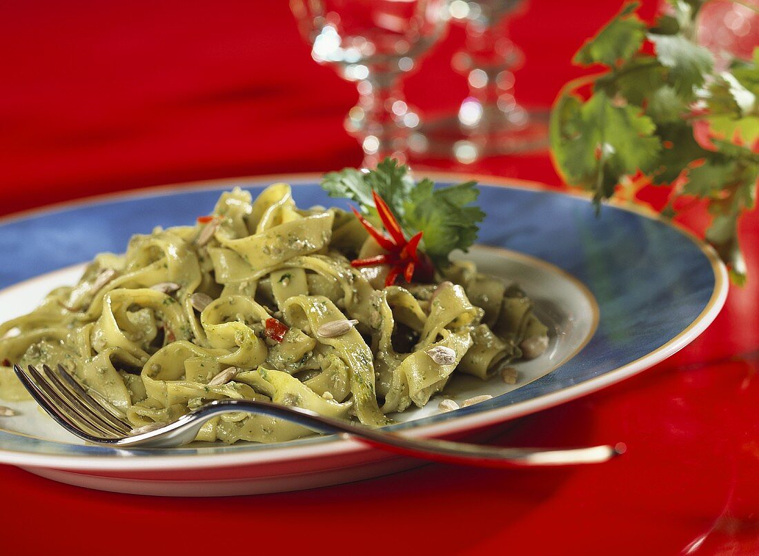 Tagliatelle with coriander leaves and sunflower seeds