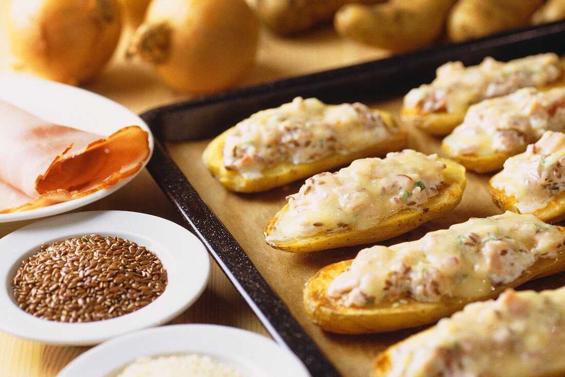 Baked potatoes with ham and sesame 