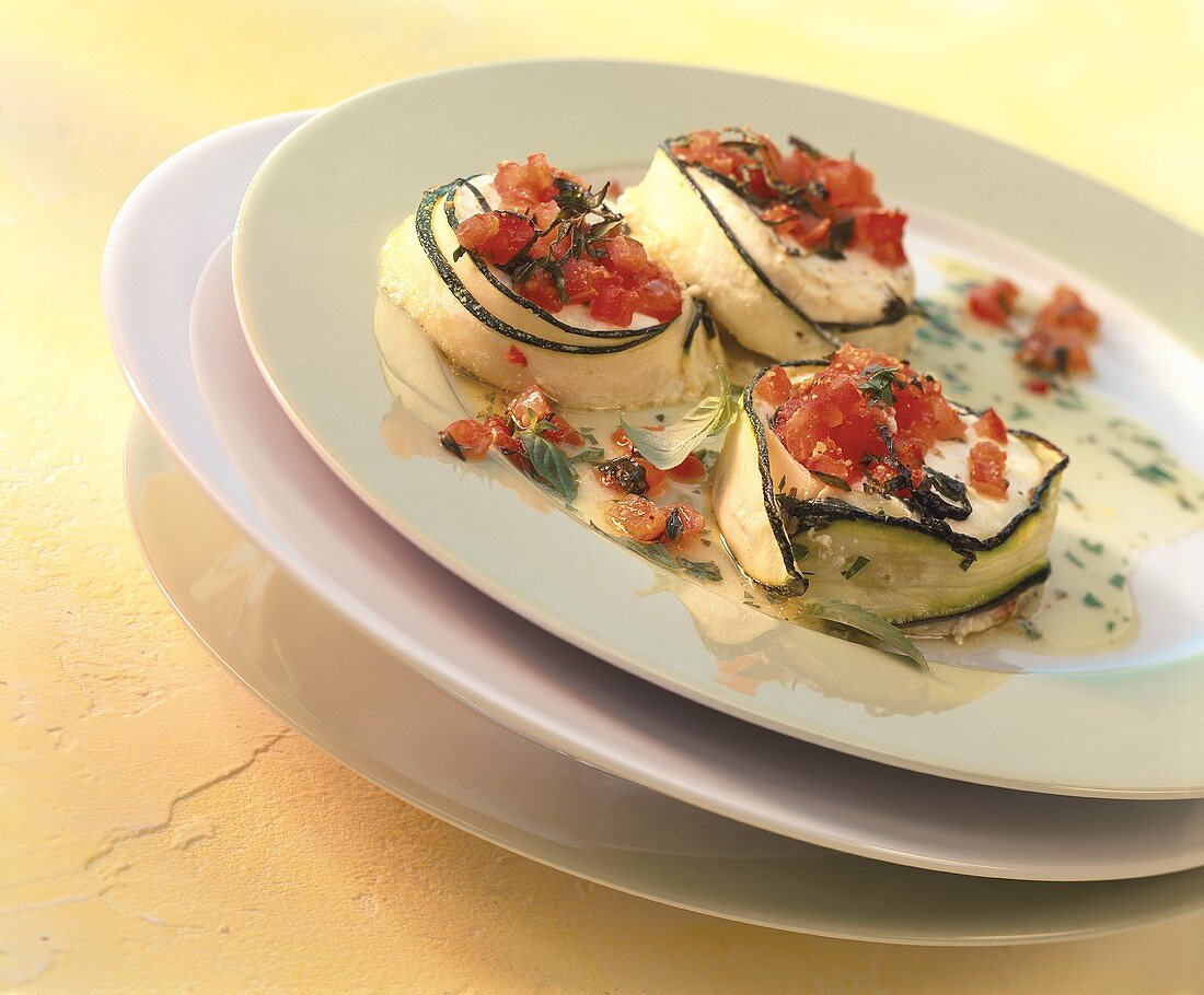 Goat's cheese in courgette strips with tomatoes & vinaigrette
