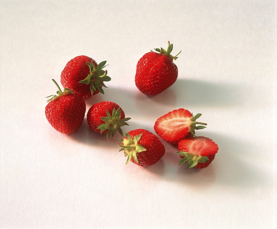 Fresh strawberries, one halved
