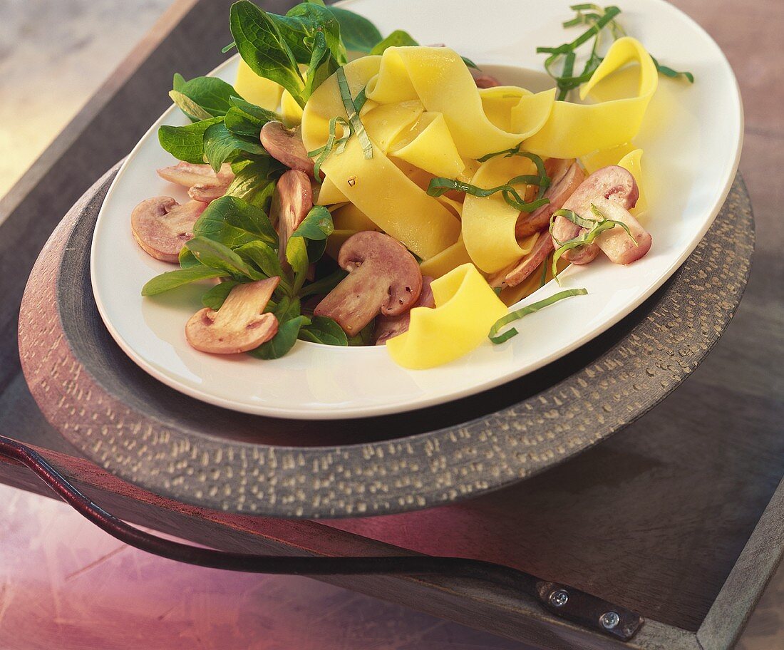 Pasta salad with marinated mushrooms and corn salad