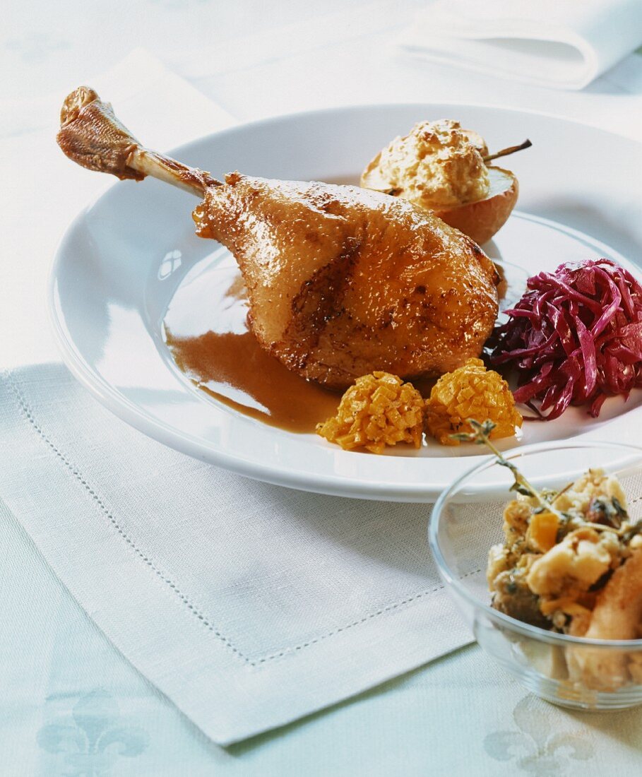 Roast leg of goose with red cabbage, apple and pumpkin