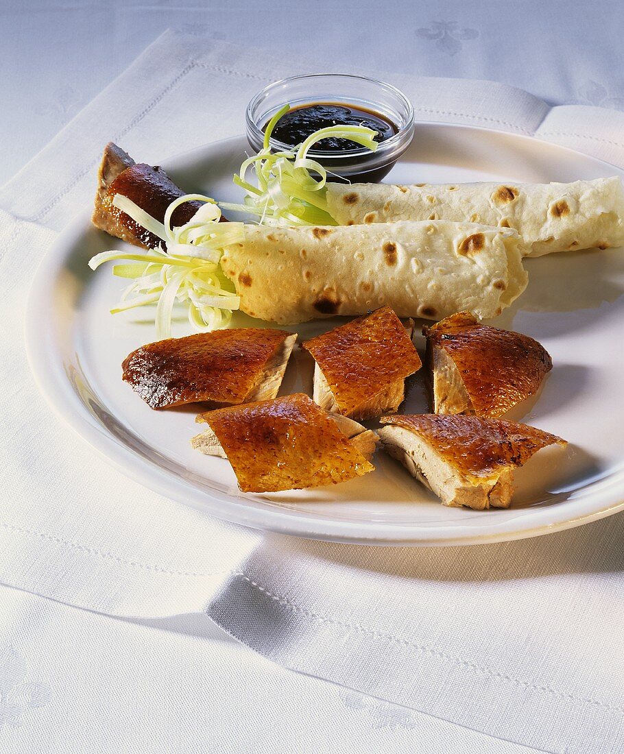 Peking duck with pancakes, sauce and spring onions