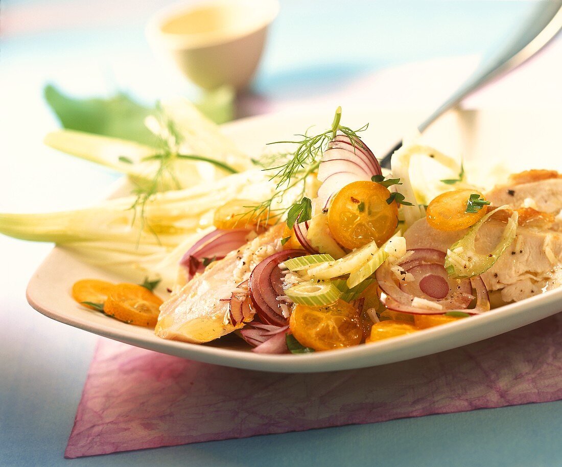 Vegetable salad with chicken and kumquats