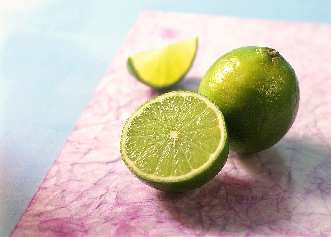 Whole lime, lime half and wedge