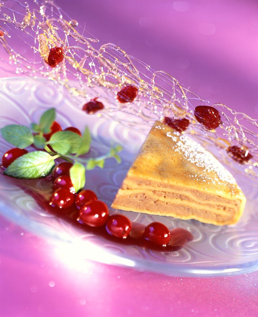 Piece of warm chestnut cake with cranberries & caramel strands