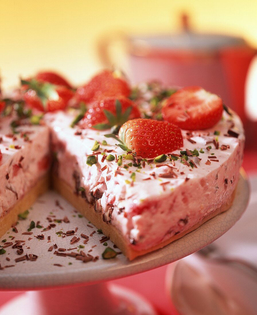 Strawberry yoghurt cake with chopped pistachios