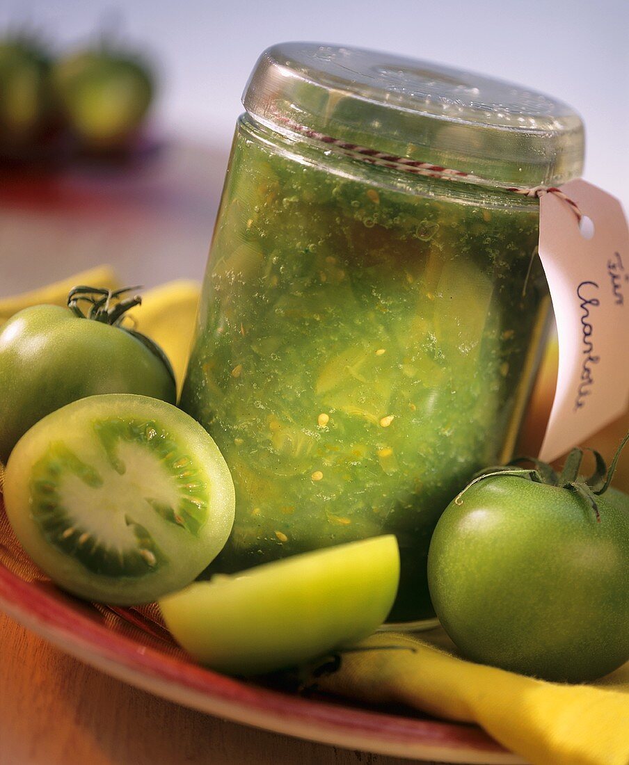 Green tomato preserve in preserving jar