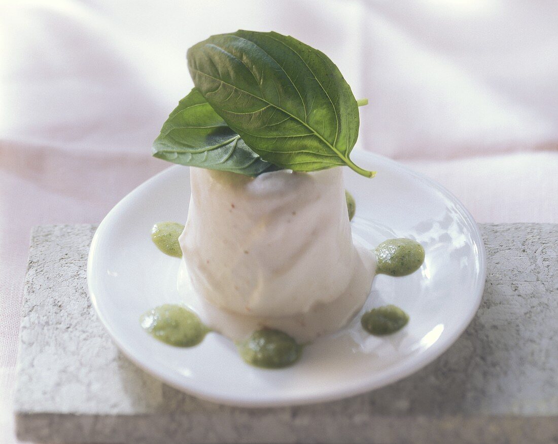 Strawberry parfait with sweet pesto and basil leaves