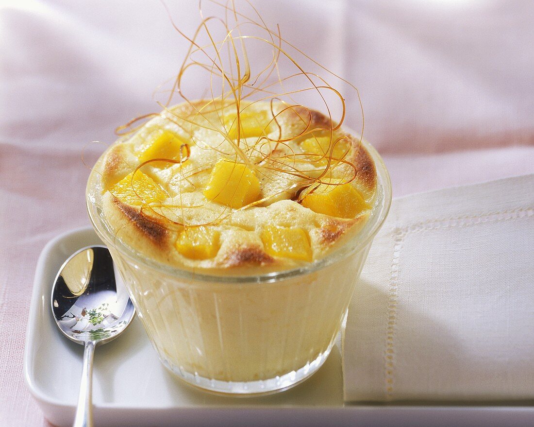 Mango and quark pudding with vanilla and caramel strands