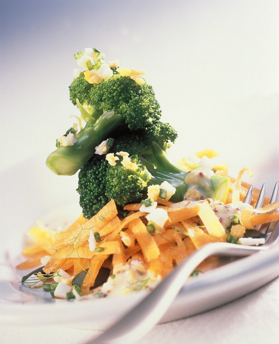 Broccoli salad with egg, carrots and pumpkin seeds