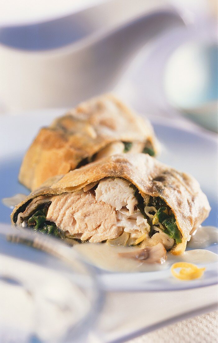 Fish strudel with spinach and lemon sauce