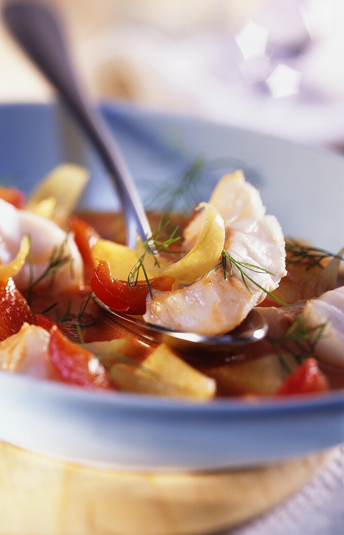 Fish stew with peppers, onions and dill