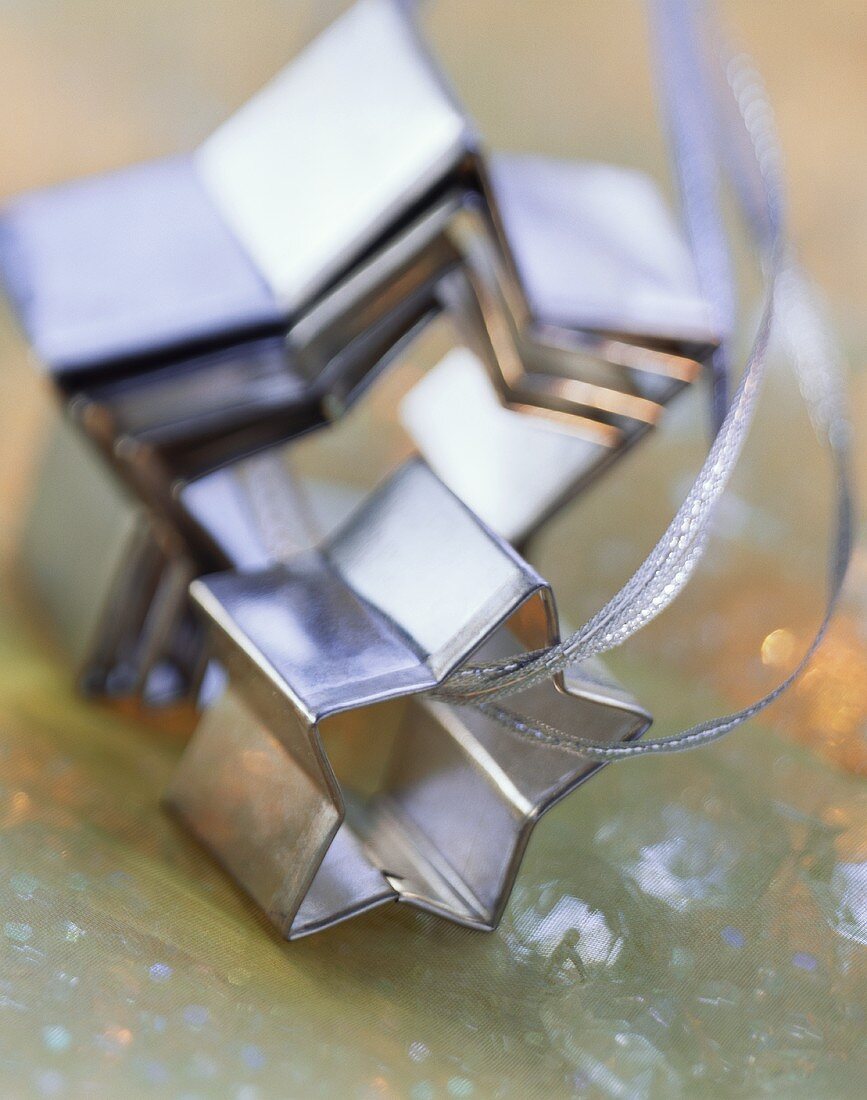 Star-shaped biscuit cutter on silver ribbon