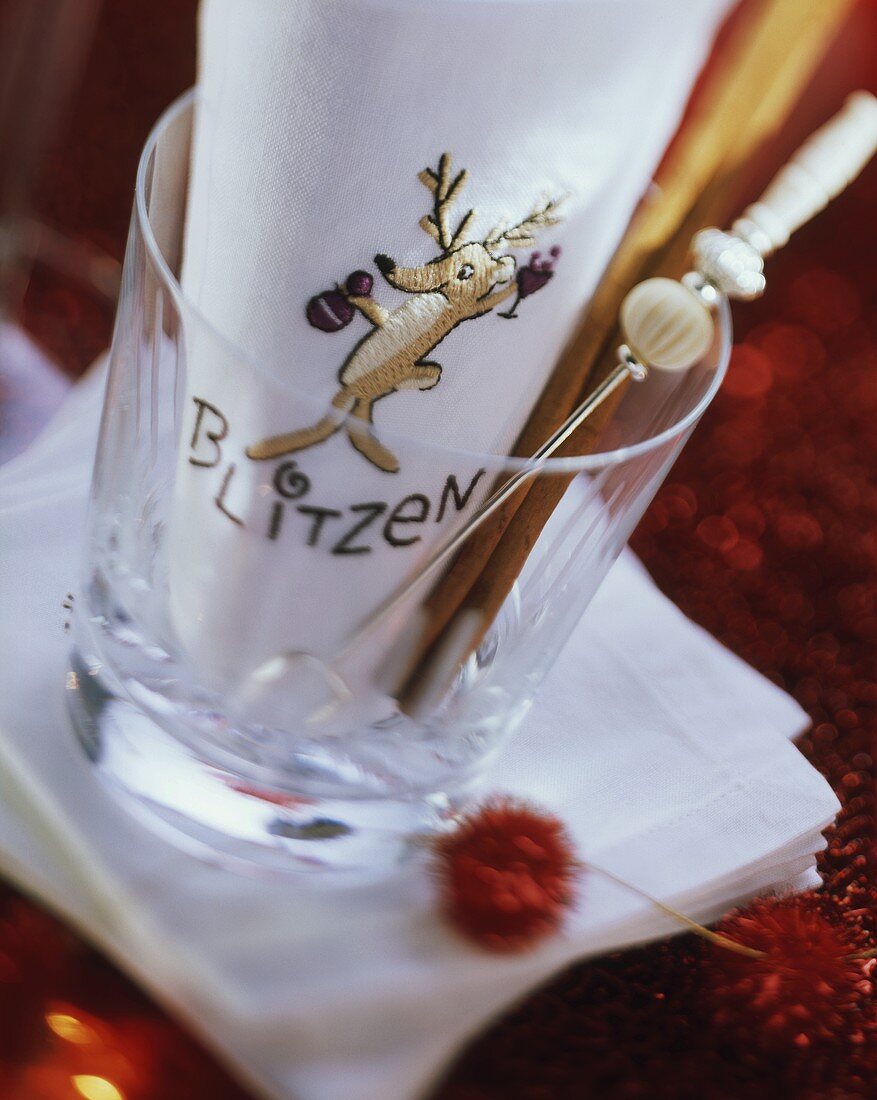 Napkin with the word Blitzen in empty glass