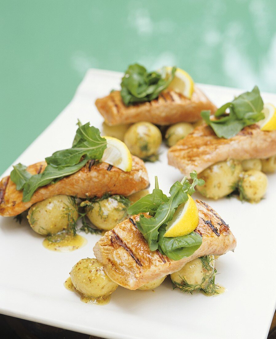 Grilled salmon fillets on dill potatoes