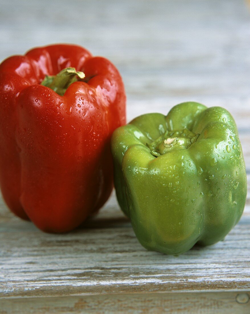Red and green peppers with drops of water