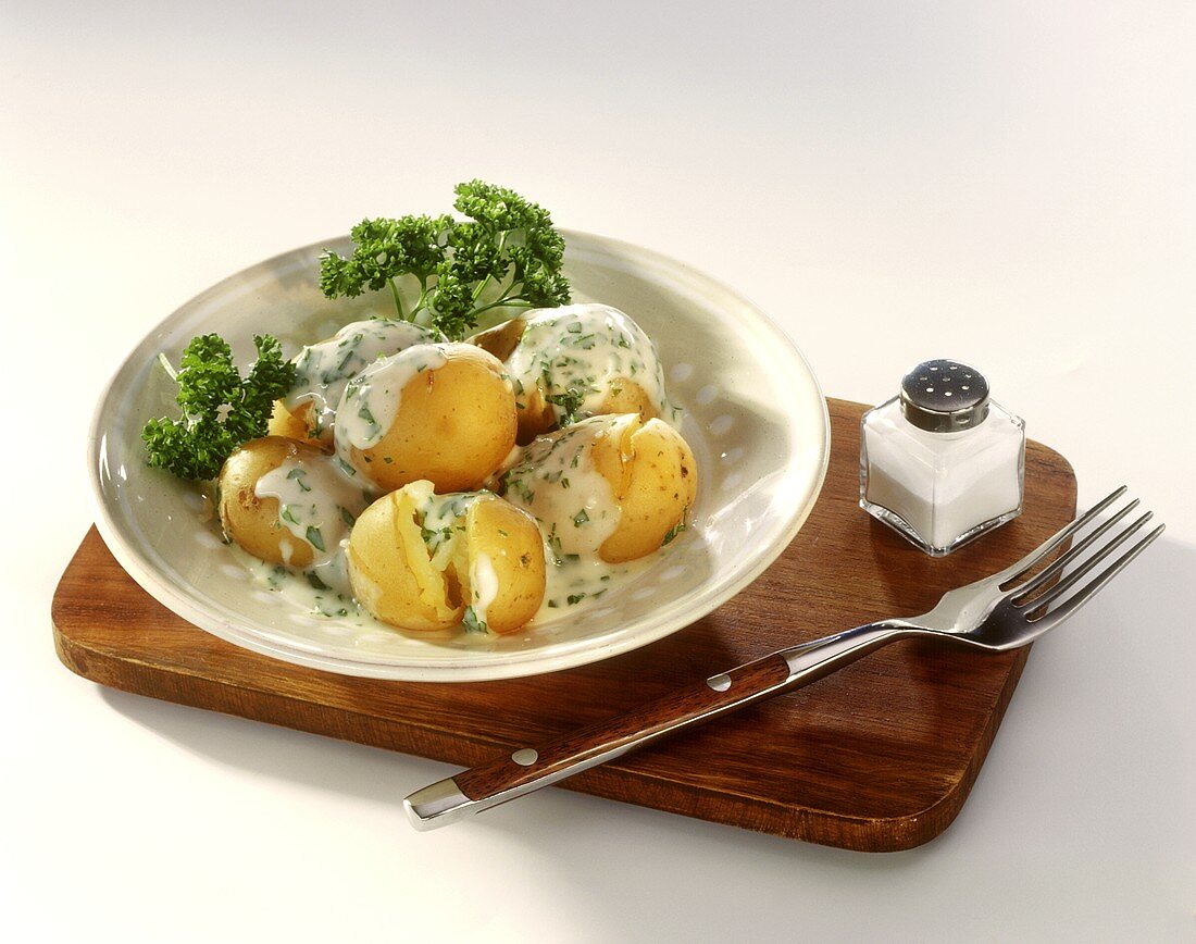 New potatoes in parsley sauce