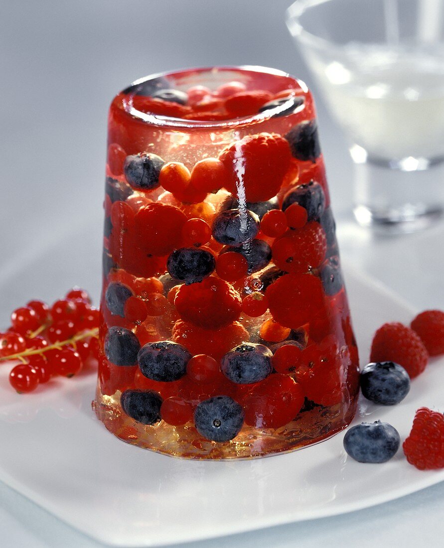 Champagne jelly with berries on plate
