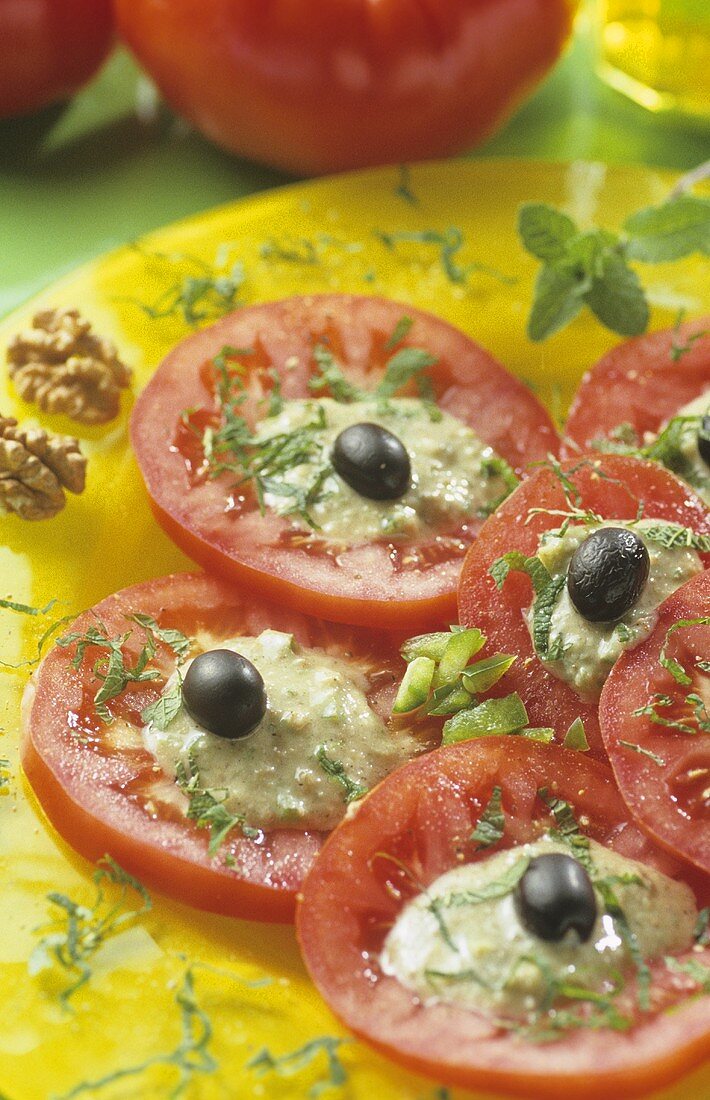 Tomato salad with walnut & vegetable dressing and olives