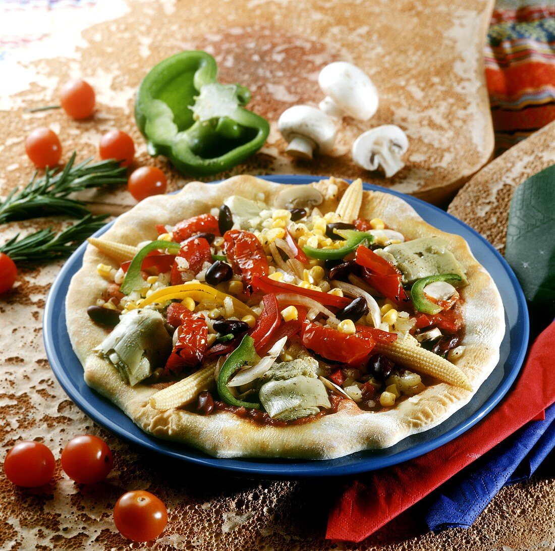 Mexican pizza with artichokes, peppers and sweetcorn