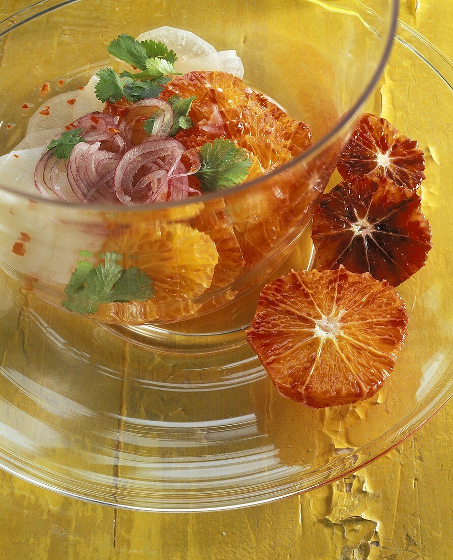 Orange and radish salad in glass bowl