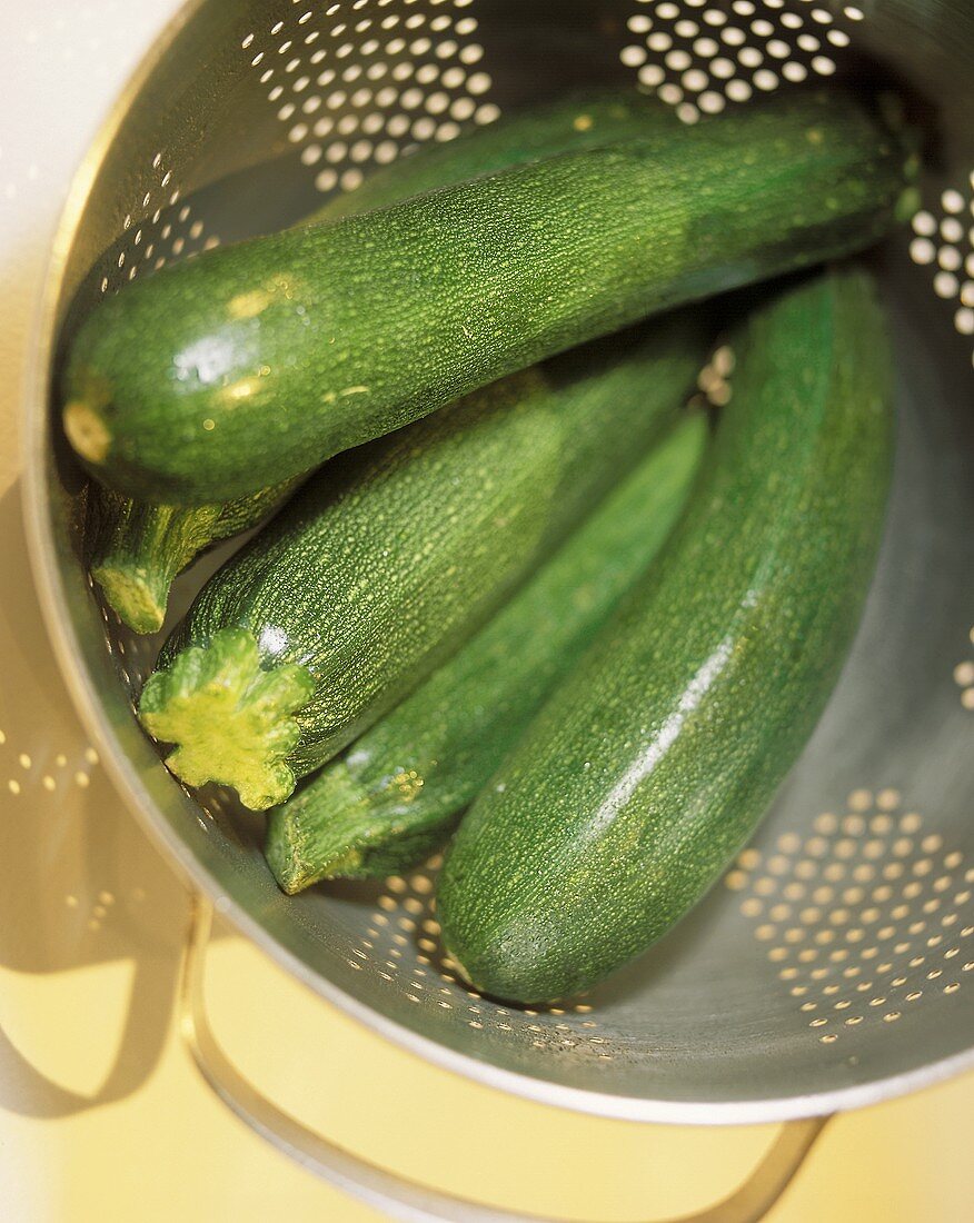 Courgettes in strainer