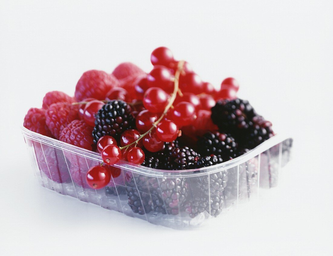 Fresh berries in plastic bowl