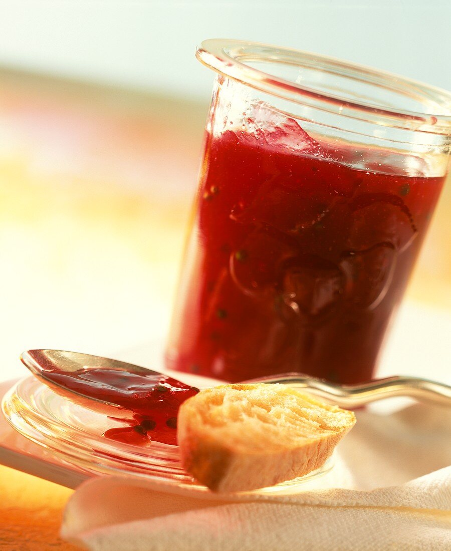 Red berry jam with green pepper in jar