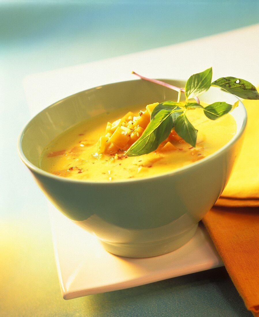 Pumpkin soup with coconut cream and Thai basil