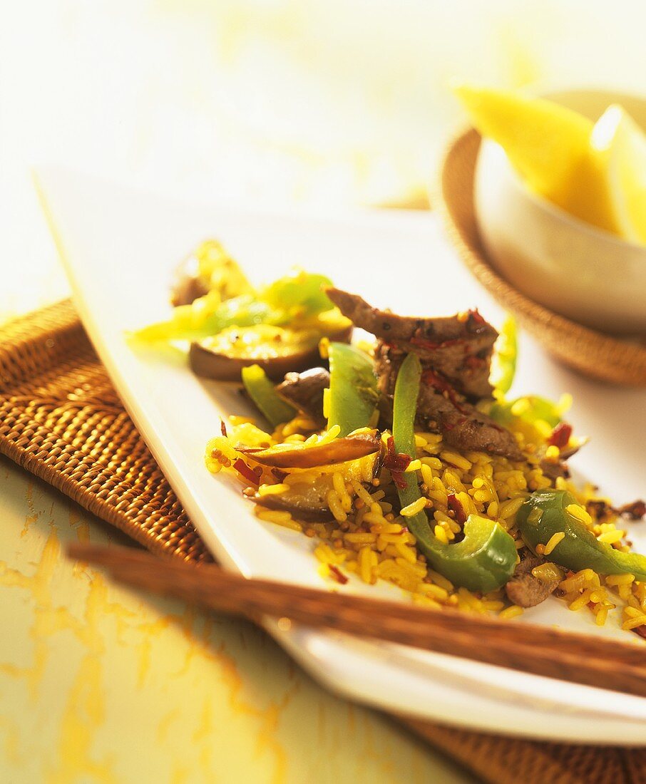 Meat with lemon and rice, with aubergines and peppers