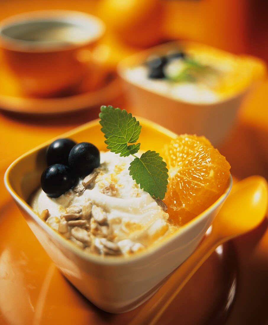 Mandarin yoghurt muesli with grapes and sunflower seeds