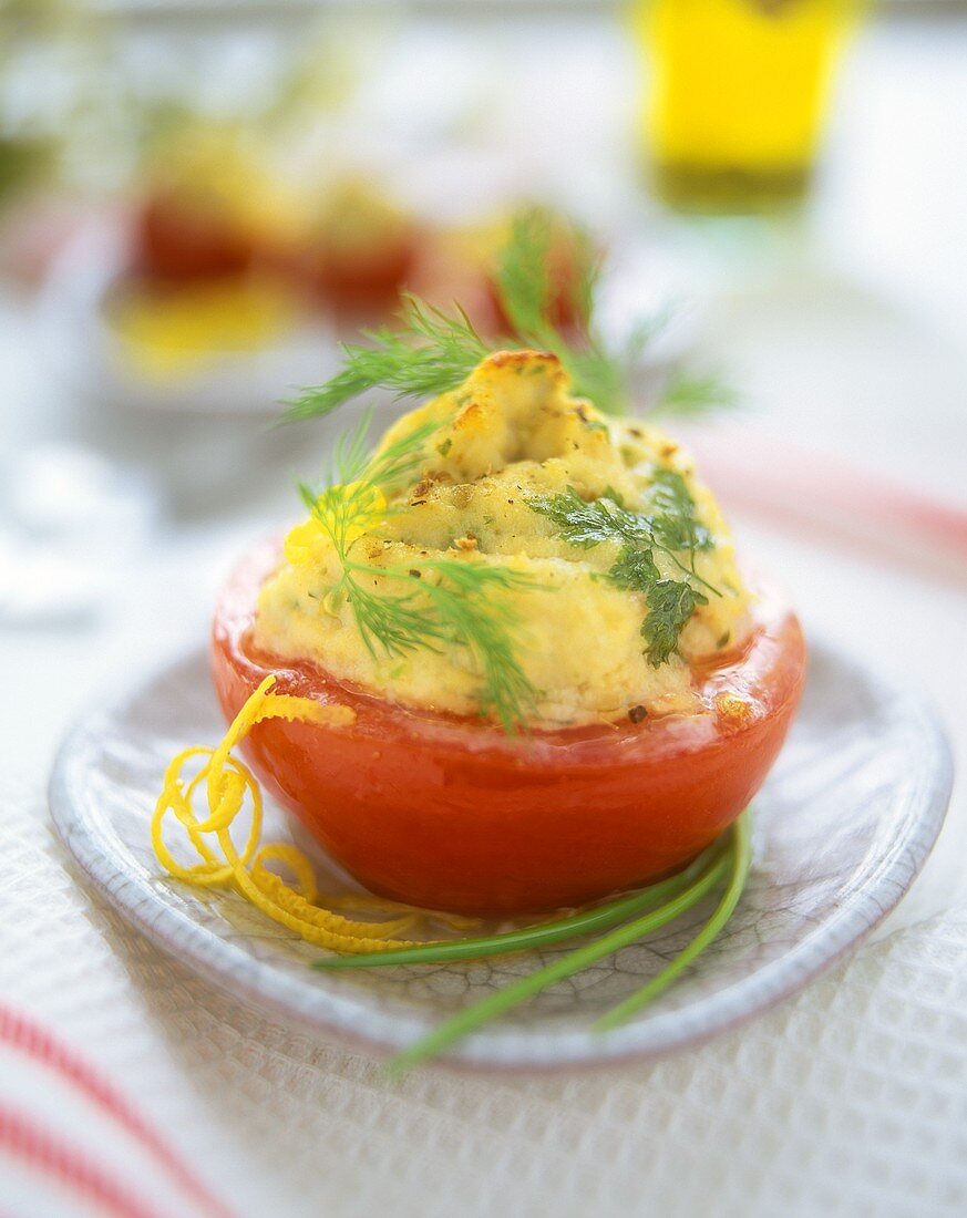 Baked tomatoes with fish puree stuffing