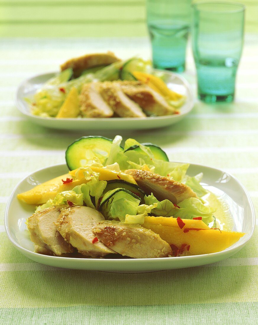 Chicken salad with mango, cucumber and iceberg lettuce