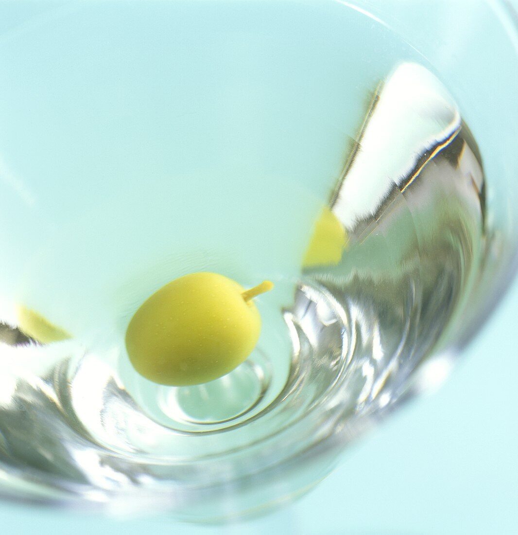 Martini with green olive