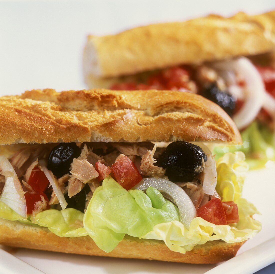 Baguette with tuna, olives and tomatoes