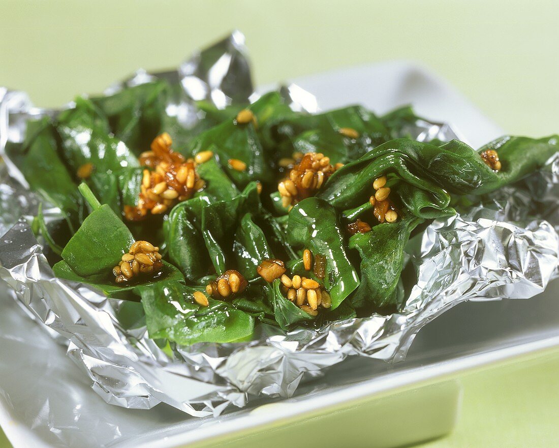 Sesame spinach in aluminium foil for picnic
